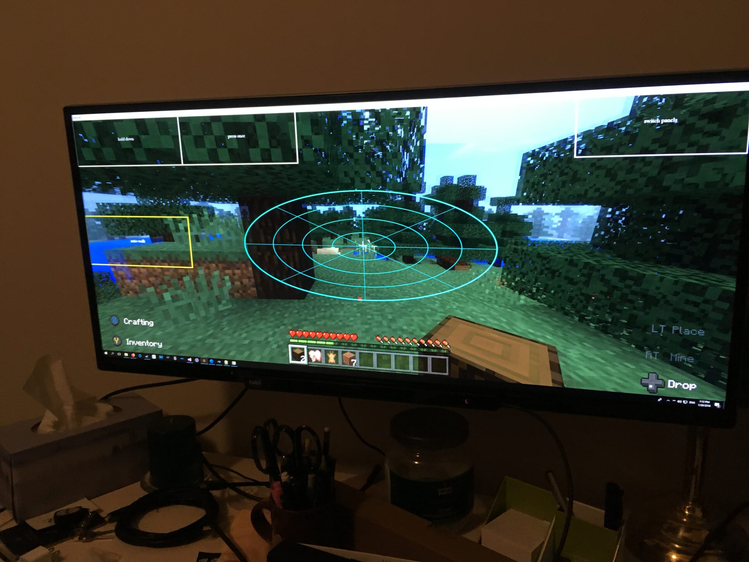 Minecraft game with eyegaze control boxes overlaid.