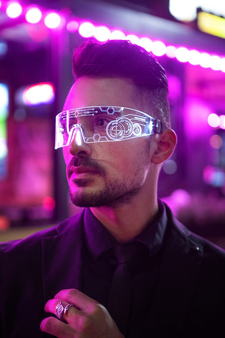 Person wearing a pair of light - see-through googles with digital shapes on them